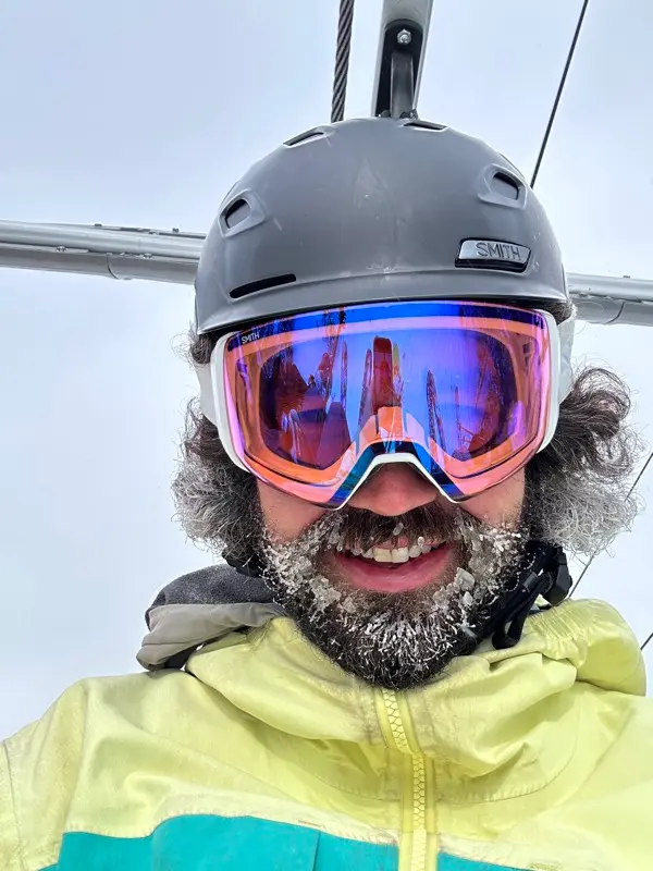 Pat on the ski lift with a frosty beard